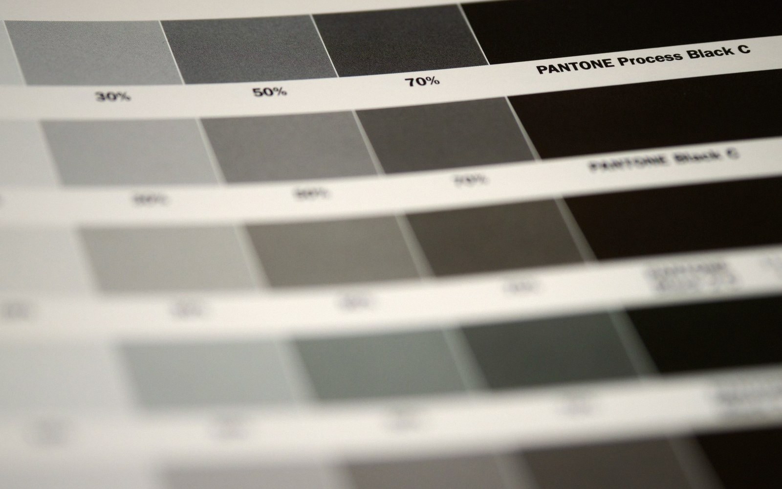 Pantone process black color swatches showing 30%, 50%, and 70% tint percentages